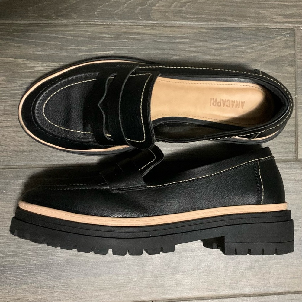 Black leather-like moccasins